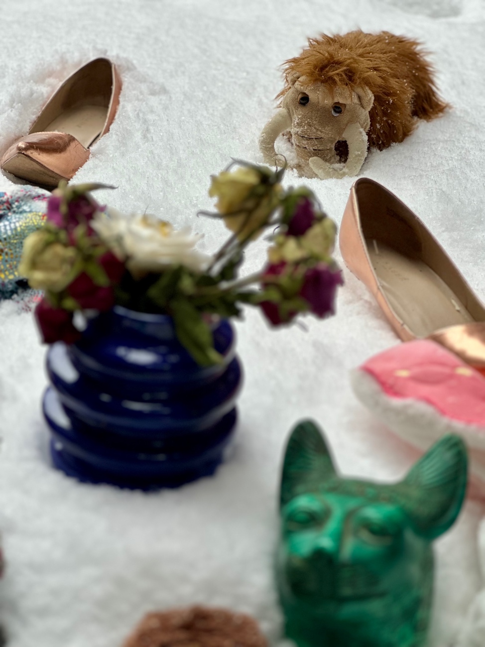 A stuffed animal and shoes on the snow
AI-generated content may be incorrect.