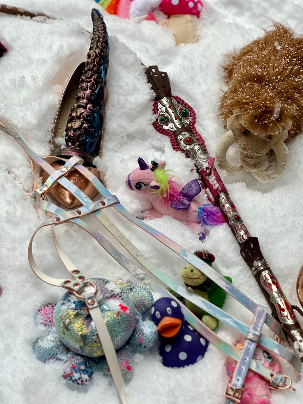 A group of toys on a white surface
AI-generated content may be incorrect.