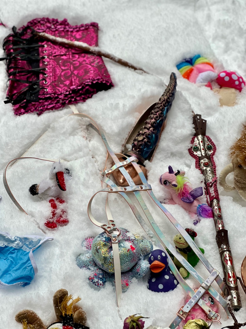 A group of toys and objects on a white surface
AI-generated content may be incorrect.