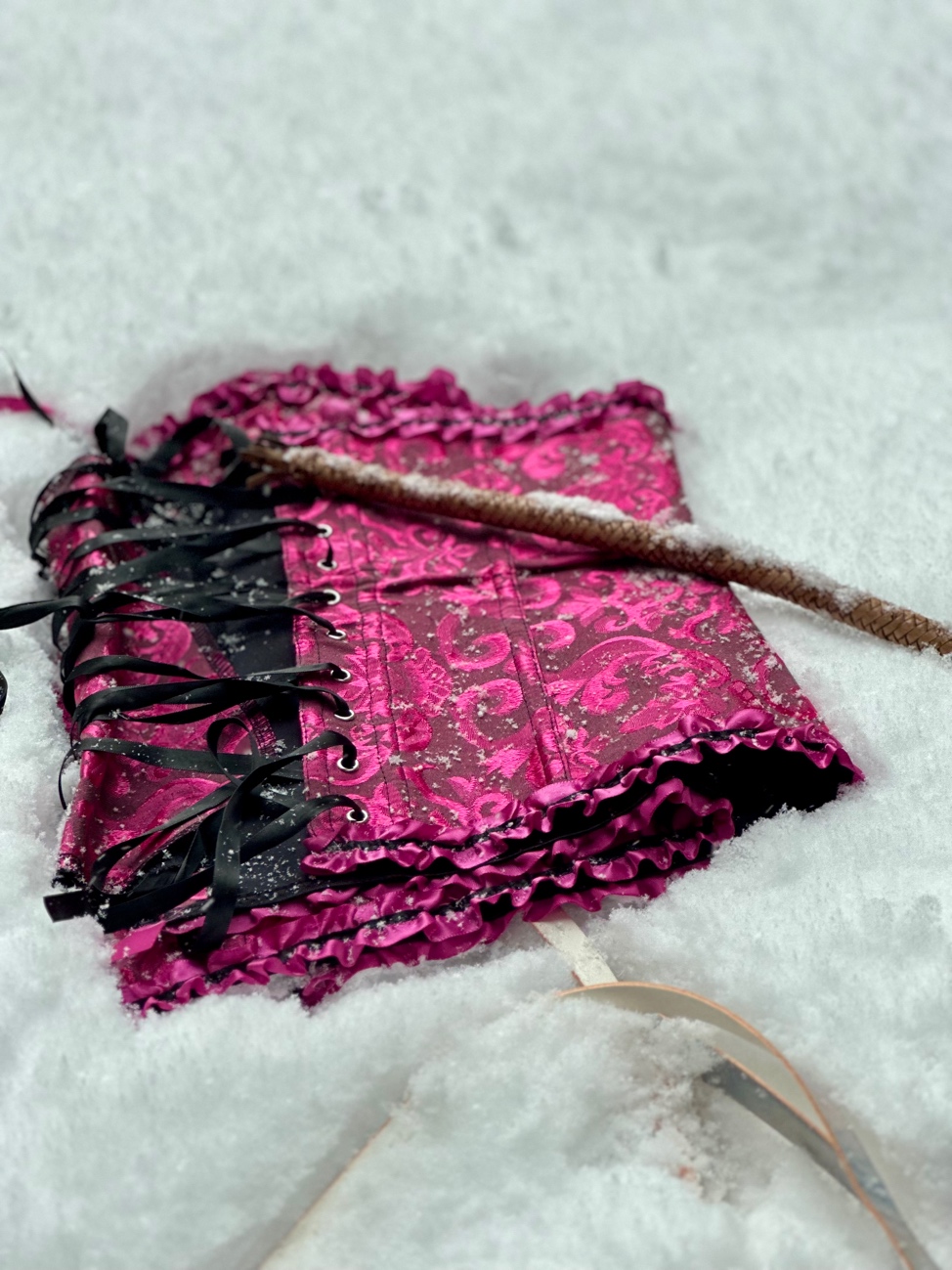 A pink corset in the snow
AI-generated content may be incorrect.